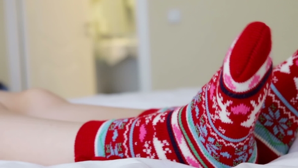 Female Legs In Christmas Socks