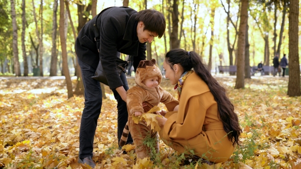 Happy Family At The Time Of The Autumn Holidays In The Woods.