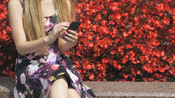 Young Girl With Smartphone Outdoors