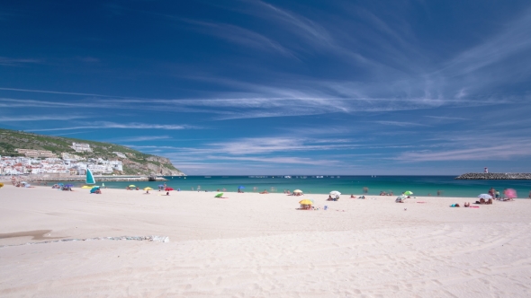 Beach In Sesimbra With Moving Clouds, Portugal