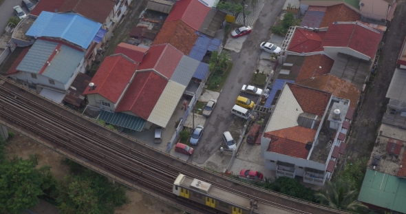 Buildings And Railway With a Passing Train In City Of Kuala Lumpur, Malaysia alt