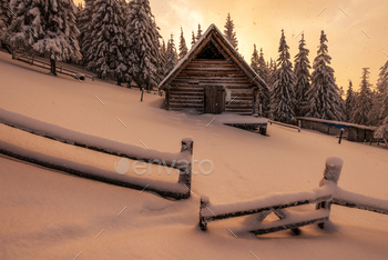 ht. Dramatic wintry scene with snowy house. Carpathians, Ukraine, Europe.