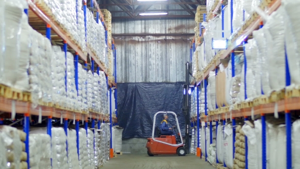 Forklift Loading Large Sacks Of Grain In Stock