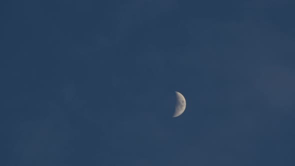 Crescent Moon Moves Through the Evening Sky Close