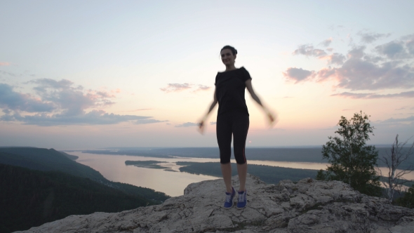 Female Exercisers On The Top Of The Mountain