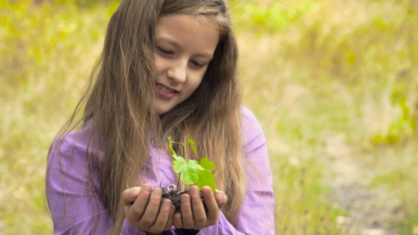 The Girl With a Plant In Hands