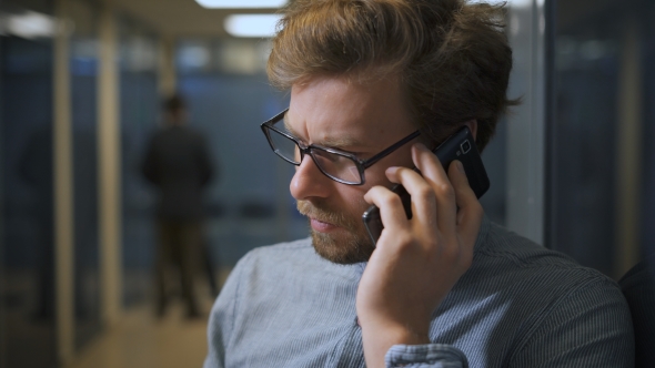 Portrait Of Businessman, Who Is Discussing Serious Questions With His Girlfriend