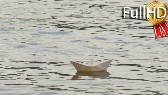 White Paper Ship is Floating by Water Childish