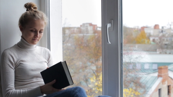 Beautiful Woman Looks At The Window