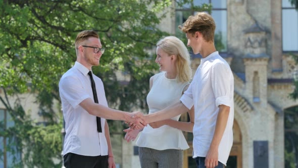 Young People Are Talking Young Men Shaking Hands