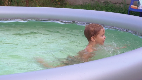 Cute Kid Swims At The Open Air