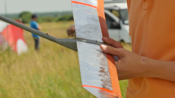 Boy is Checking an Aircraft Sports Competition