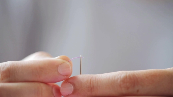 Hands Of Tailor Woman Threading Needle 30