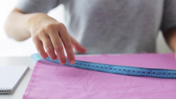 Tailor Woman With Measuring Tape And Fabric 33
