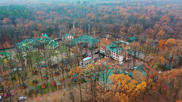 Luxury hotel aerial shot. Complex buildings surrounded by forest