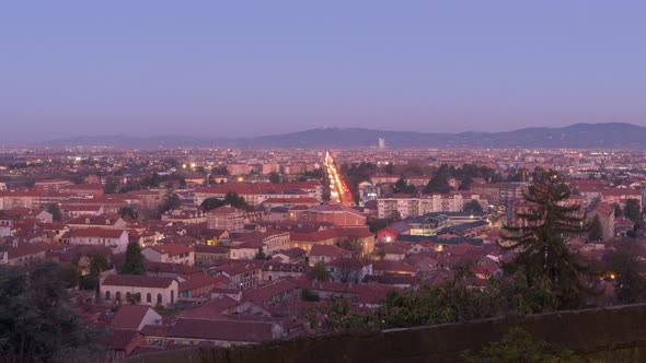 Rivoli, Italy. Night view from above of the town of Rivoli and the city of Turin. Timelapse video.