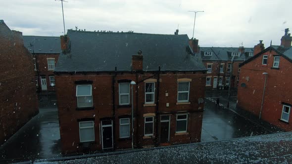 Holbeck town in a rainy hailstorm during a typically English summer