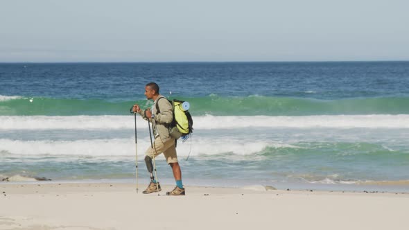 Sporty mixed race man with prosthetic leg hiking