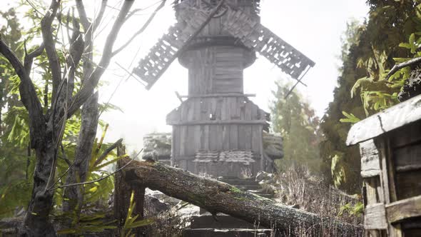 Old Traditional Wooden Windmill in the Forest alt