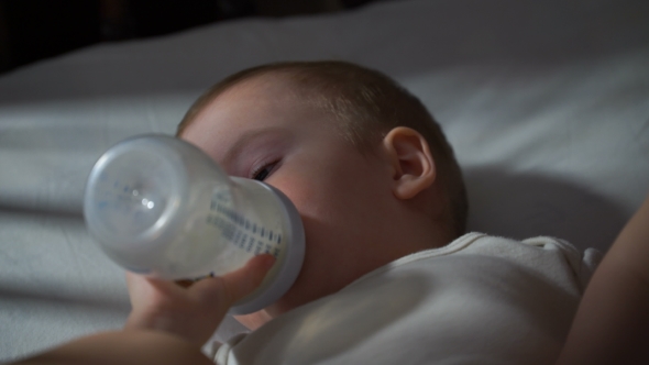 Footage Baby Eating Baby Food From a Bottle.