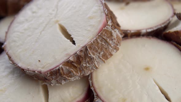 Fresh sliced cassava root. Yucca dry plant. Manioc slices. Macro