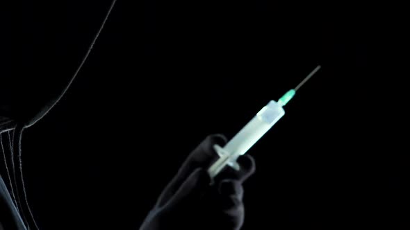 Dealer Preparing to Inject to Client Portion of Strongest Narcotic Substance