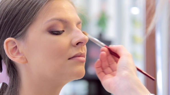 Professional Make-up Is Being Done By Make-up Artist