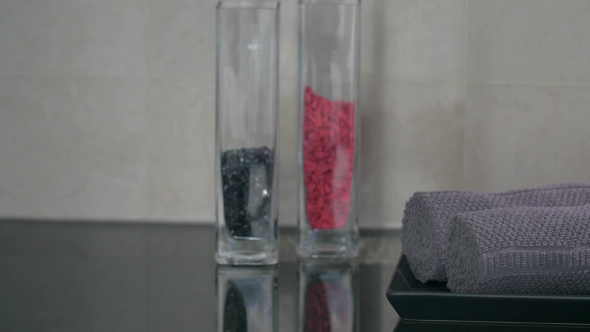 View Of Woman Hand Putting On Plate Rolls Of Towels