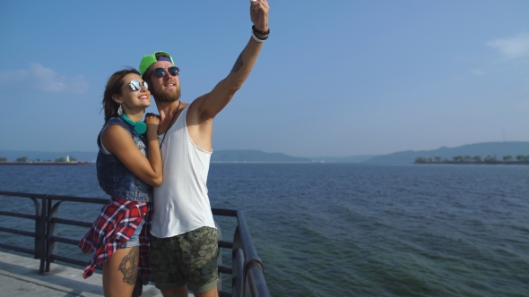 Young Couple Taking Selfi On Vacation At The Waterfront