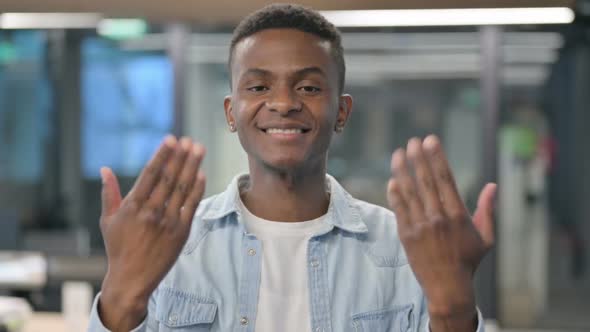 Portrait of African Man Pointing at Camera, Inviting