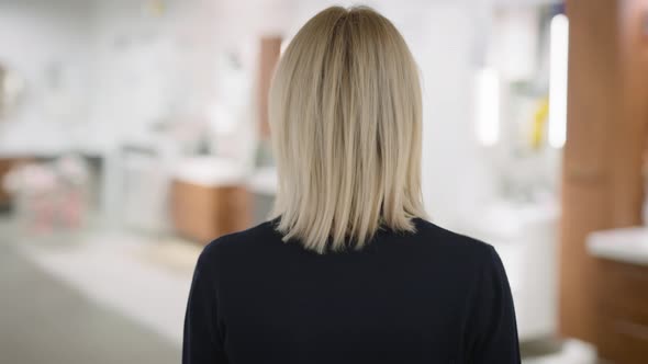 A Woman in a Household Goods Store