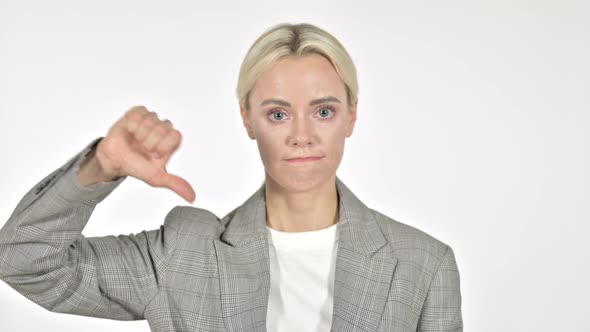 Businesswoman Gesturing Thumbs Down on White Background