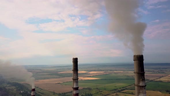 Aerial View of High Chimney Pipes with Grey Smoke From Coal Power Plant