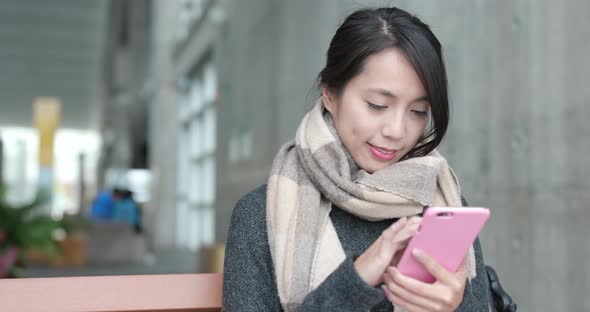 Woman use of smart phone in campus