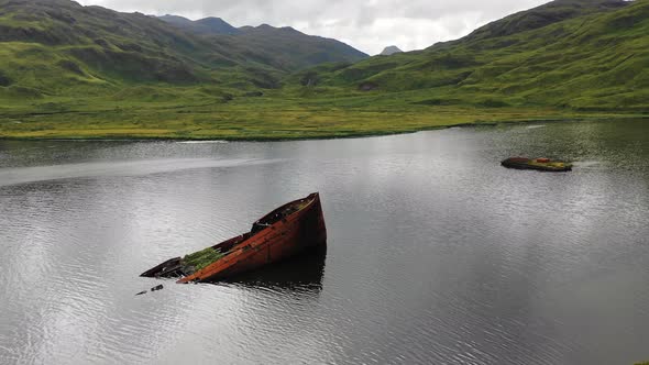 Aerial view of a shipwreck in Captain Bay in Unalaska, Alaska, United States.