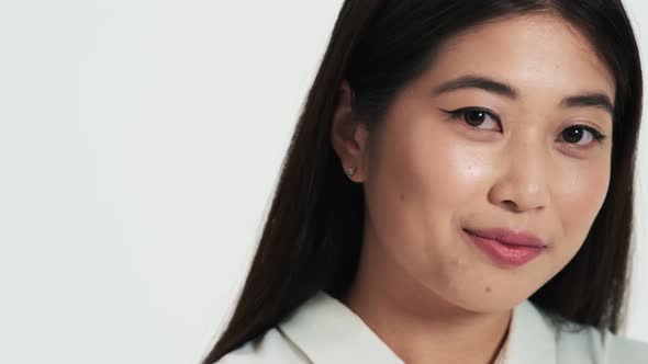 Close-up view of a charming asian korean woman posing