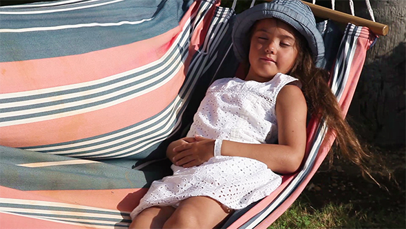 Little Girl Sleeping in a Hammock