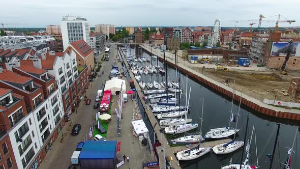 Moored yachts on the pier before the start of the sailing