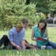 Young People Are Sitting on a Lawn Reading - VideoHive Item for Sale
