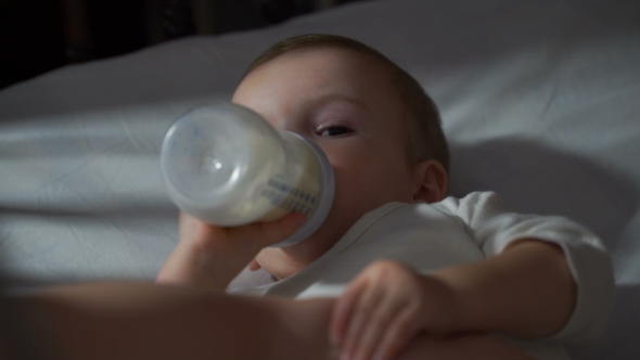 Baby Eating Baby Food From a Bottle