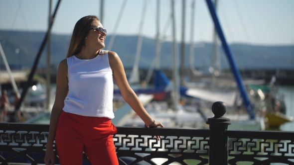 Woman At The Pier Near Yacht On The Background Of Blue Sky, Selective Focus