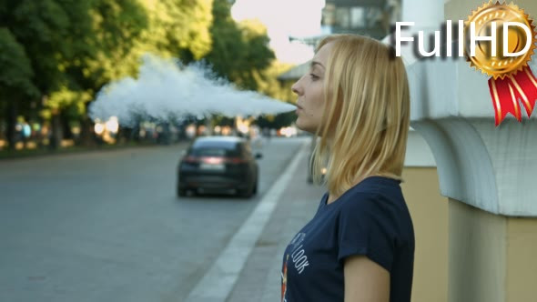 Young Girl Vaporizes the E-Cigarette 05