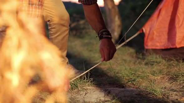 Tourist Sets Up A Tent.