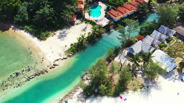 Natural overhead travel shot of a paradise sunny white sand beach and turquoise sea background in hi