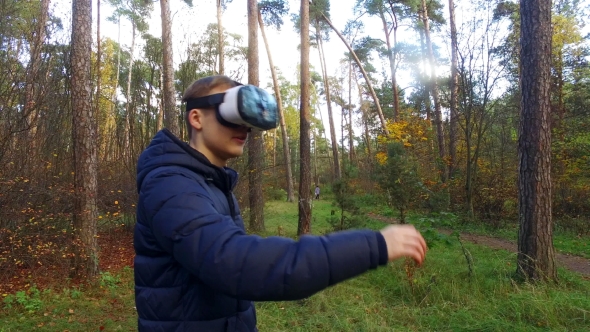 Teenager With Glasses Of Virtual Reality