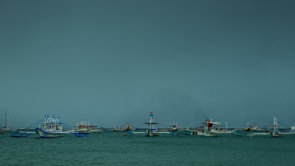 Fishing Boats In The Sea In a Storm.   - August 2016, El Nido Palawan, Philippines