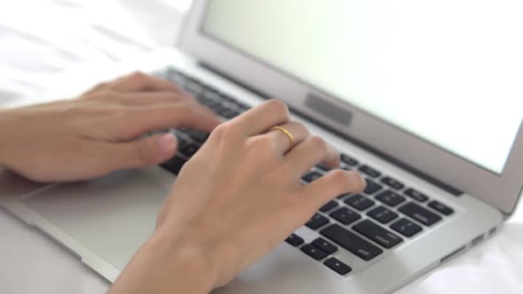 Closeup young asian woman using laptop for leisure on bedroom.