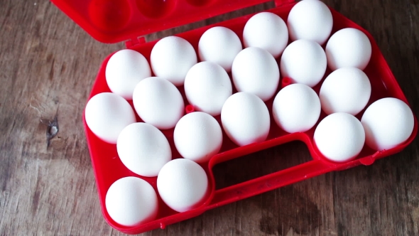 Raw Eggs In a Red Plastic Tray Or Box