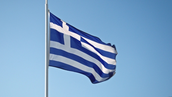 Greece Flag Waving In The Wind Against The Sky