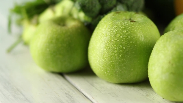Ripe Green Apples With Drops On The Wooden Background